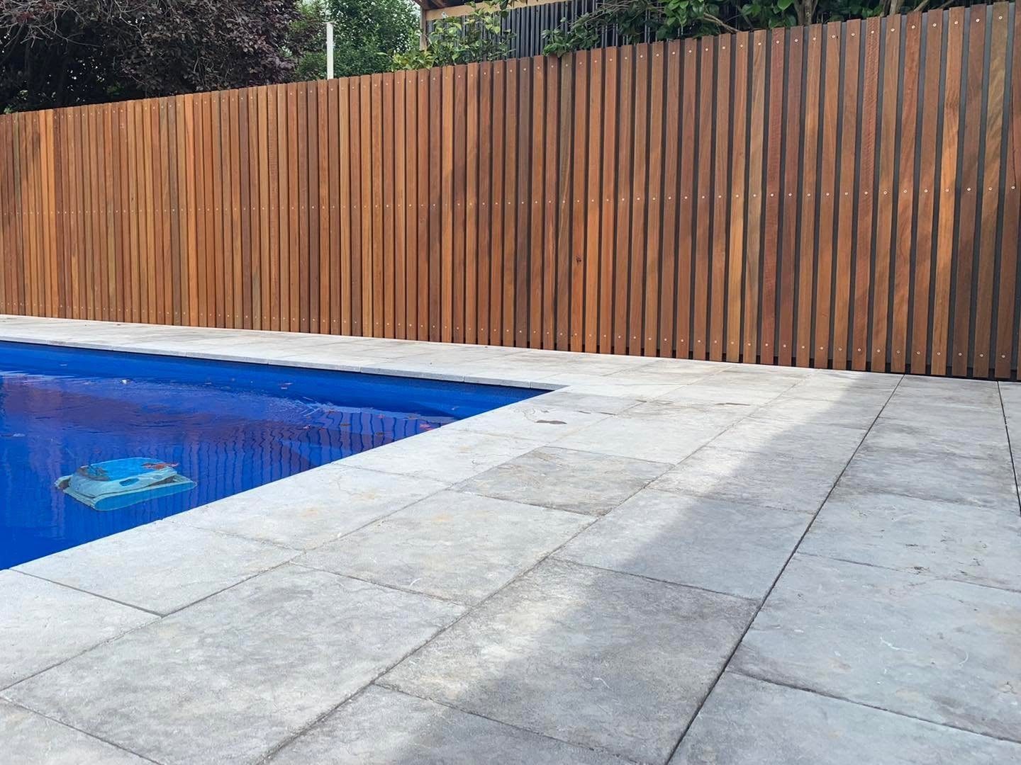 Premium pool paving and timber privacy fence